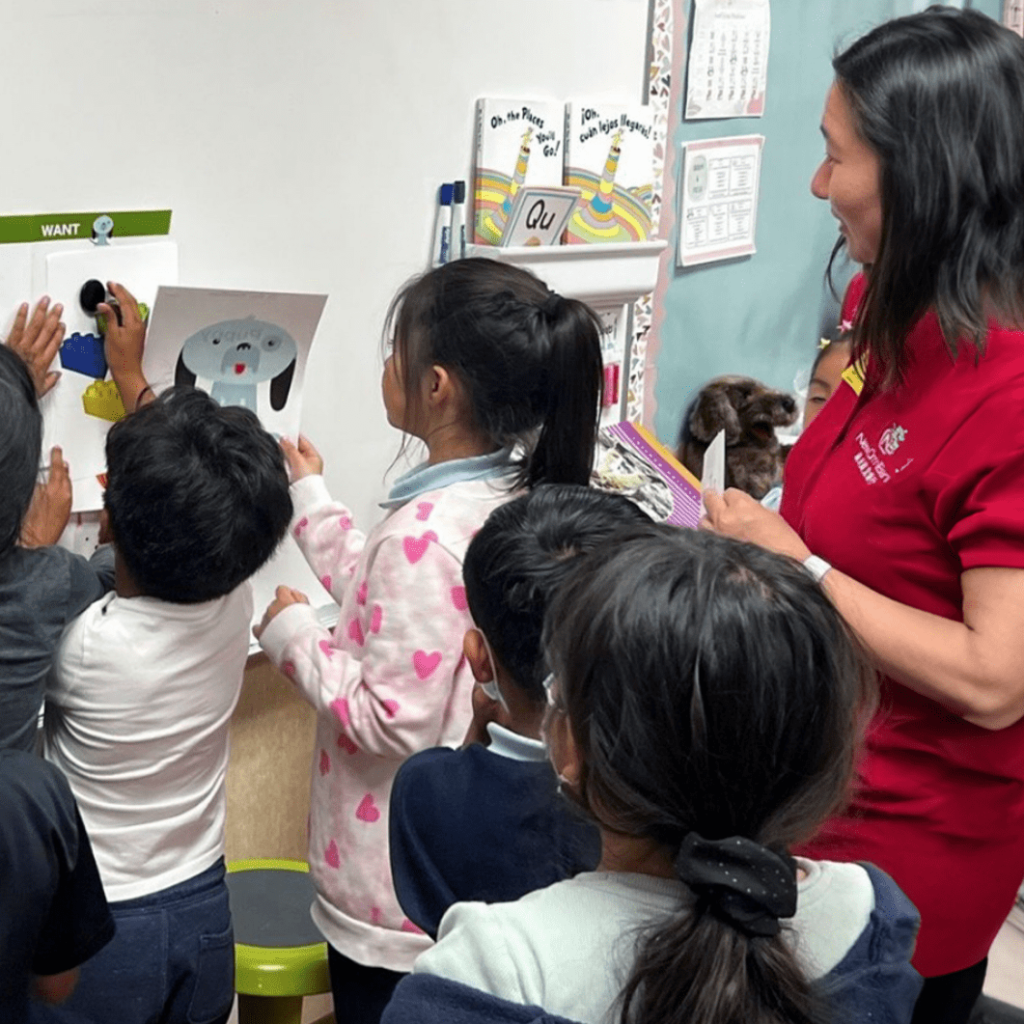 Children engaging in a financial literacy workshop led by a New Omni Bank team member.