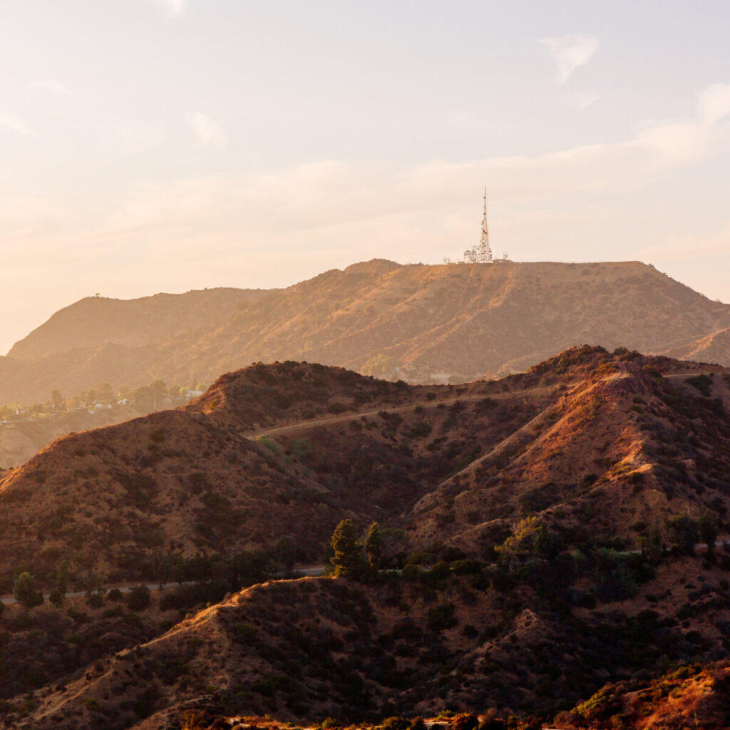 A mountain range with a tower on top in Los Angeles, California.