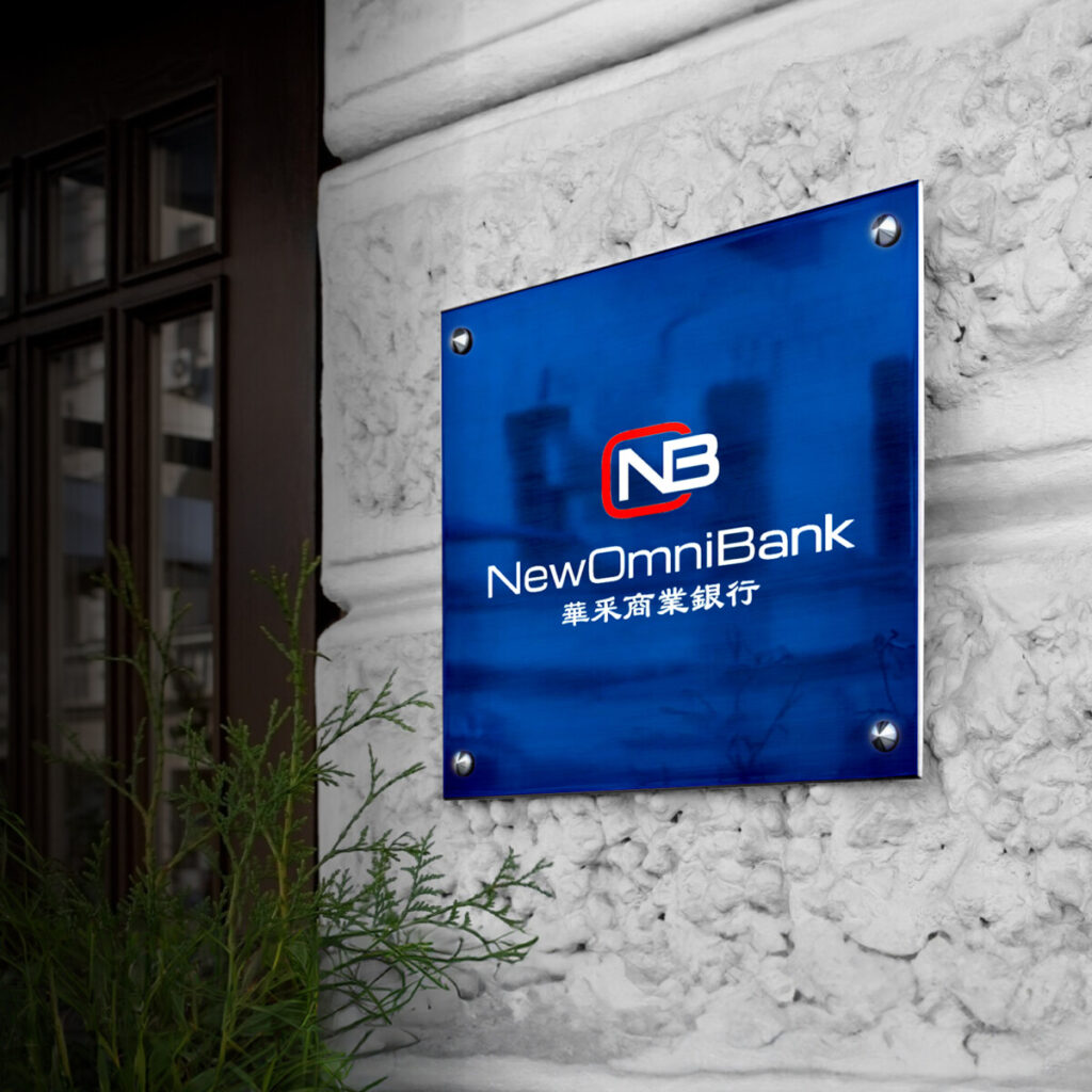 The exterior signage of a New Omni Bank branch entrance.