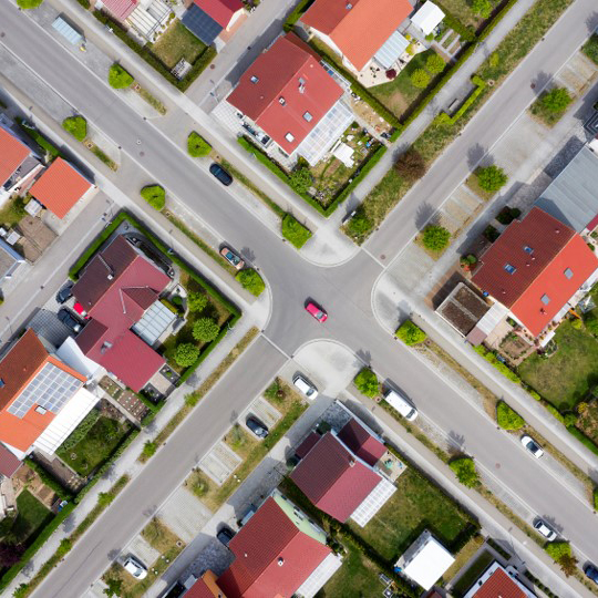 A road intersection with houses and roads.