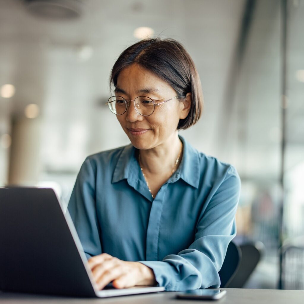 A woman using laptop.