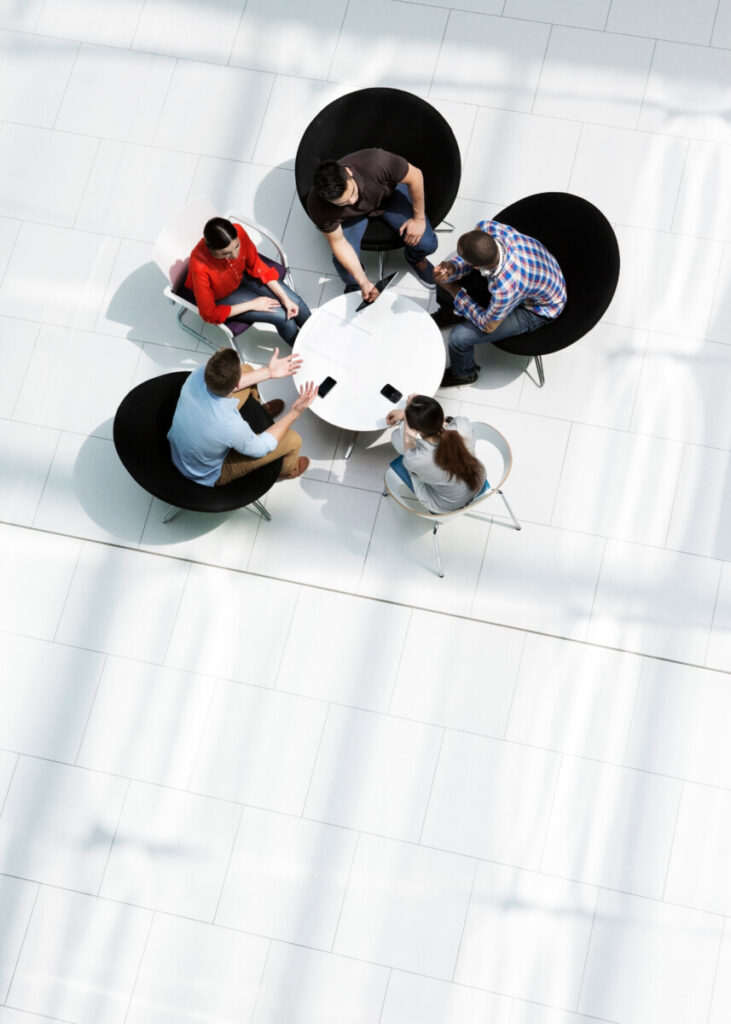 Overhead view of colleagues in a meeting