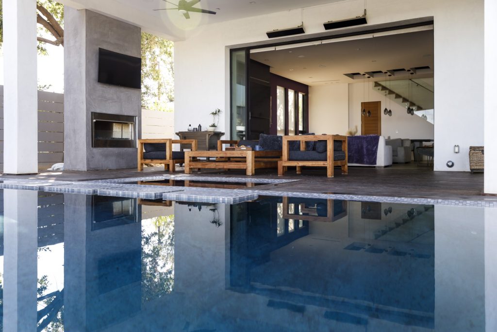 View of a luxury home’s poolside lounge — ideal for borrowers qualifying with bank statements or flexible income