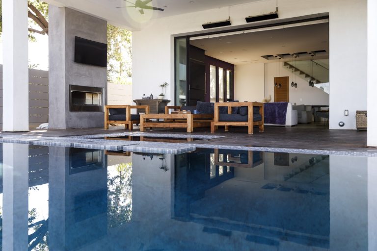 View of a luxury home’s poolside lounge — ideal for borrowers qualifying with bank statements or flexible income