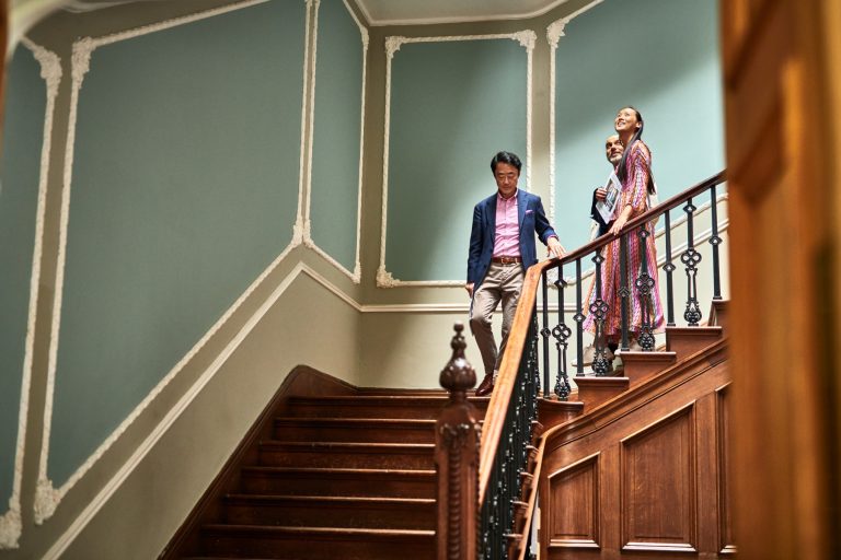 Diverse couple viewing a potential new home, symbolizing tailored mortgage solutions for international buyers and new immigrants.