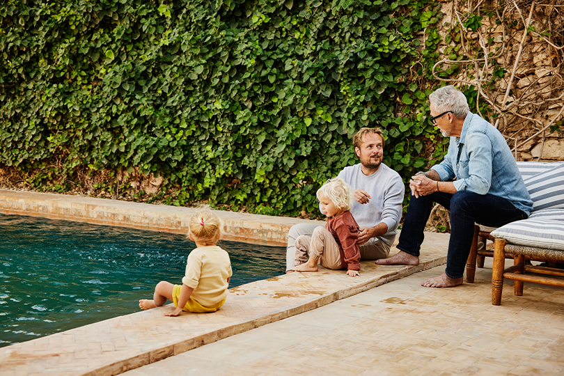 A family spending quality time together at the poolside in their home