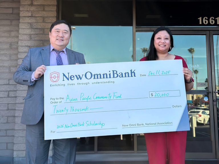 Leon Sung, Managing Director and CRA Officer of New Omni Bank, presents a $20,000 donation check to Karen Fan, Operations Manager of the Asian Pacific Community Fund