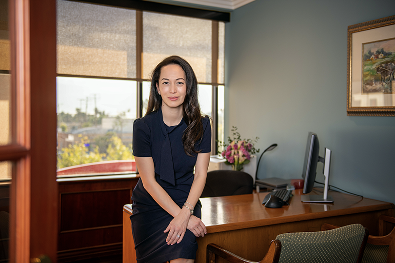 New Omni Bank President & COO Edythe Repoff in her office.