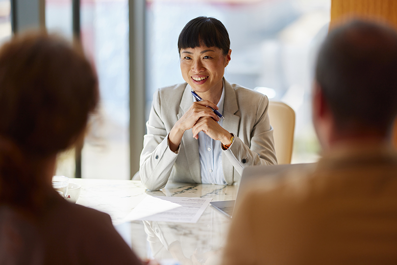 Relationship banker speaking with customers during an account opening consultation.