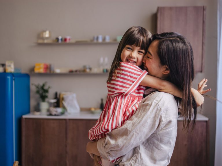 A mother and child in a modern kitchen — representing flexible home equity financing through a HELOC